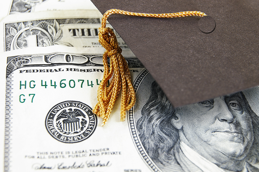bigstock-graduation-cap-on-money-31505735.jpg