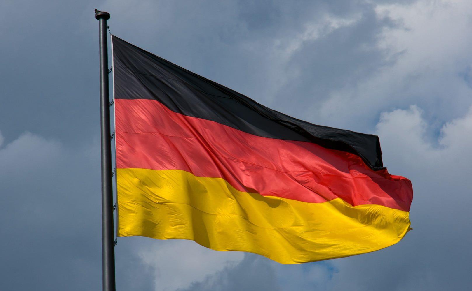 german-flag-in-front-of-dark-clouds-PDLQF4S-1800x1000.jpg