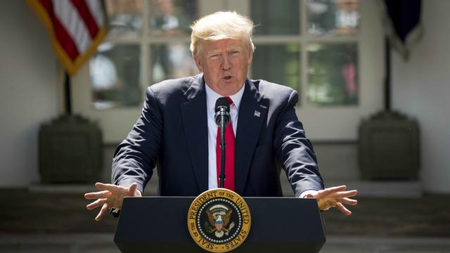 033042600_1496371565-Trump_Climate_Hand.jpg