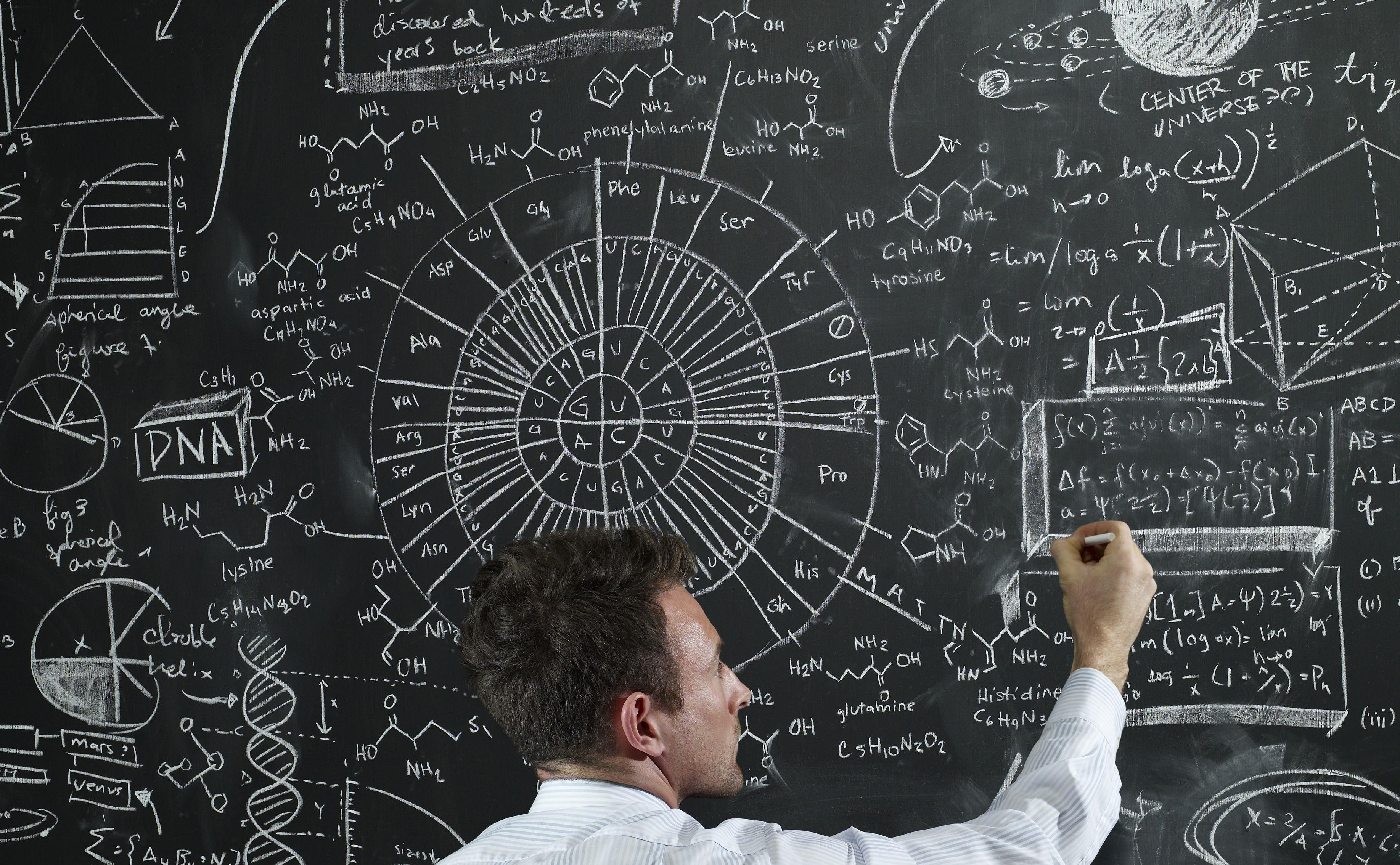 teacher-writing-equations-on-the-black-board-98841893-5b38028bc9e77c001afafa19.jpg