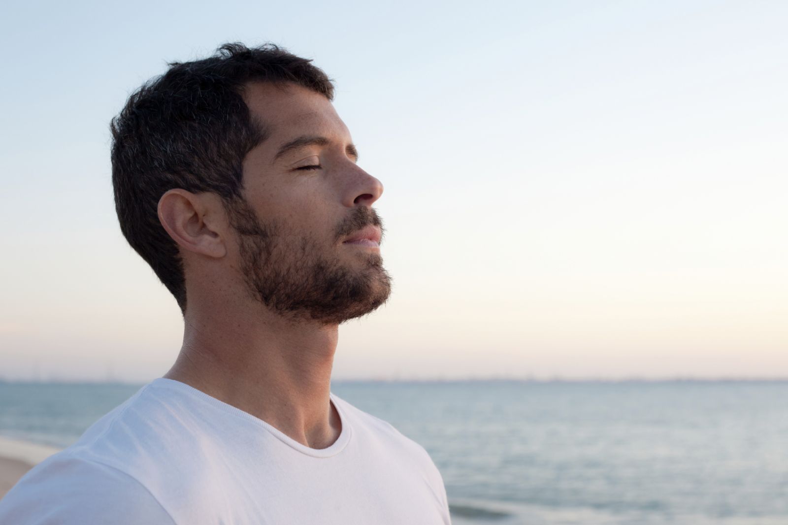 man-destressing-relaxing-mindful-meditation-iStock_000019084932_Medium.jpg
