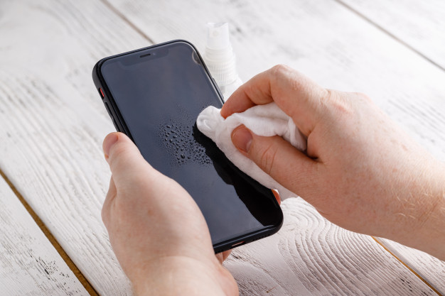 phone-screen-disinfecting-wipe-cleaning-removing-germs-with-antibacterial-wipes-corona-virus-covid-19_155165-14808.jpg